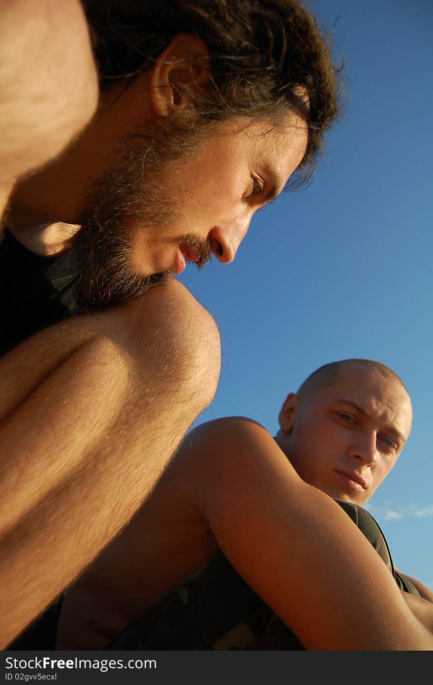 Two men sitting outdoor