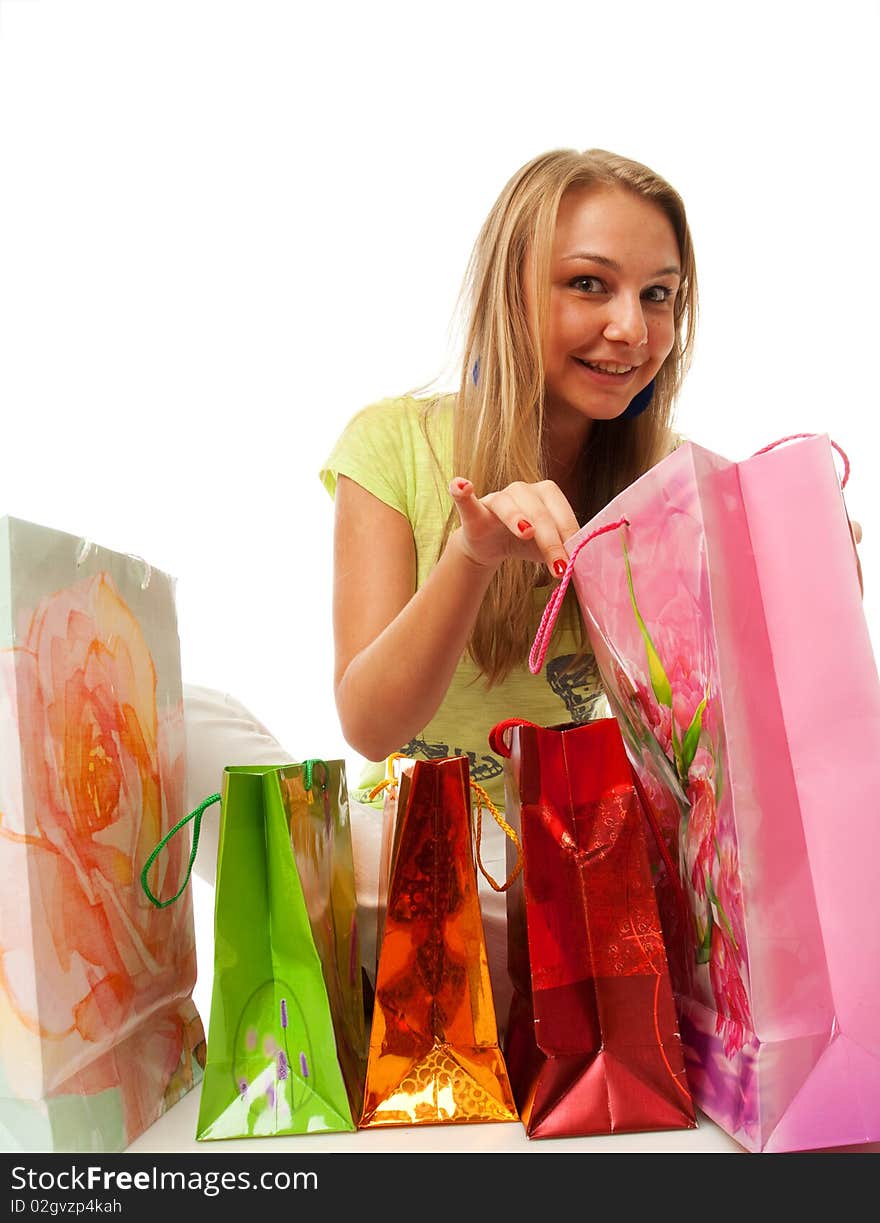 The beautiful girl with packages isolated on a white background