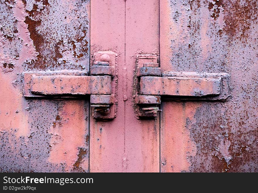 Old rusty metal hinge in the centre