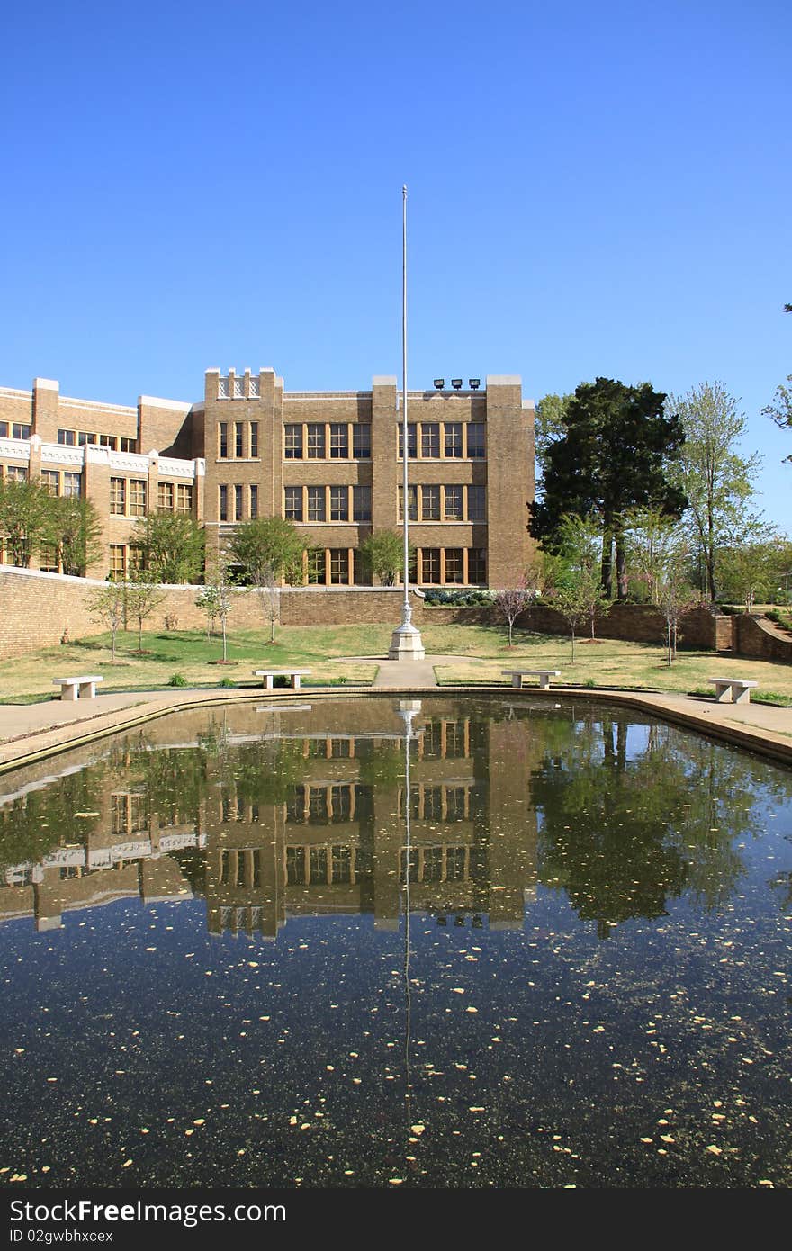 Image in a high school combined with buildings, water and reflection. Image in a high school combined with buildings, water and reflection.