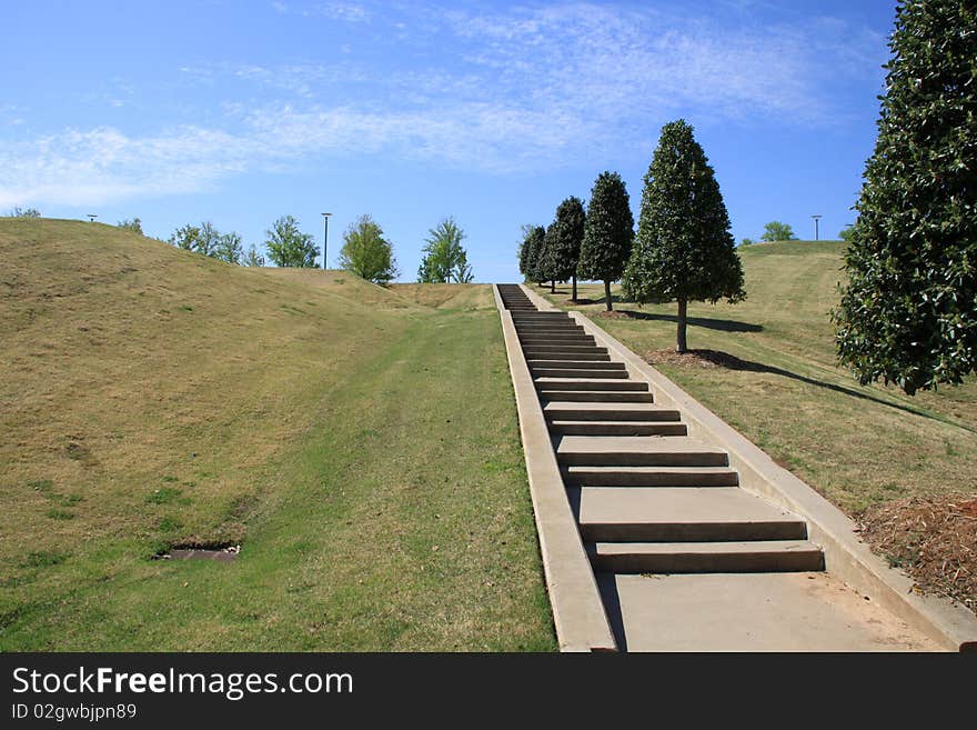 Stpes going to higher, with green plants aside and blue sky above. Stpes going to higher, with green plants aside and blue sky above.