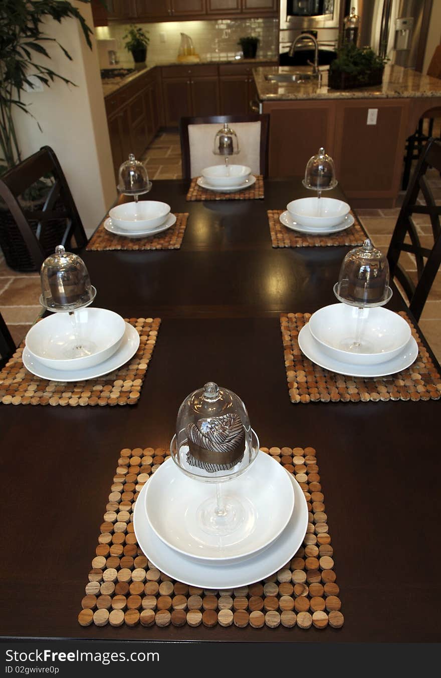 Modern dining table with luxury tableware and decor. Modern dining table with luxury tableware and decor.