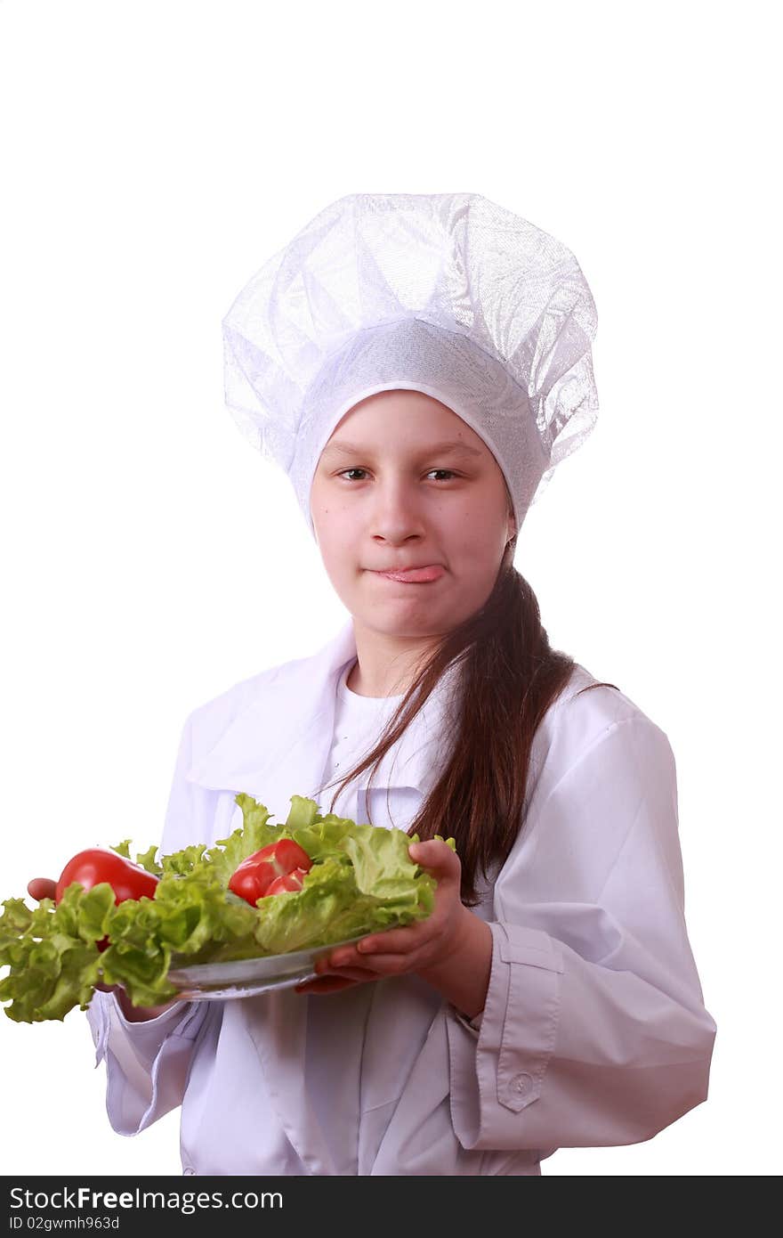 Portrait of teenager girl in chef uniform with vegetarian food. Isolated on white by lighting setup. Portrait of teenager girl in chef uniform with vegetarian food. Isolated on white by lighting setup