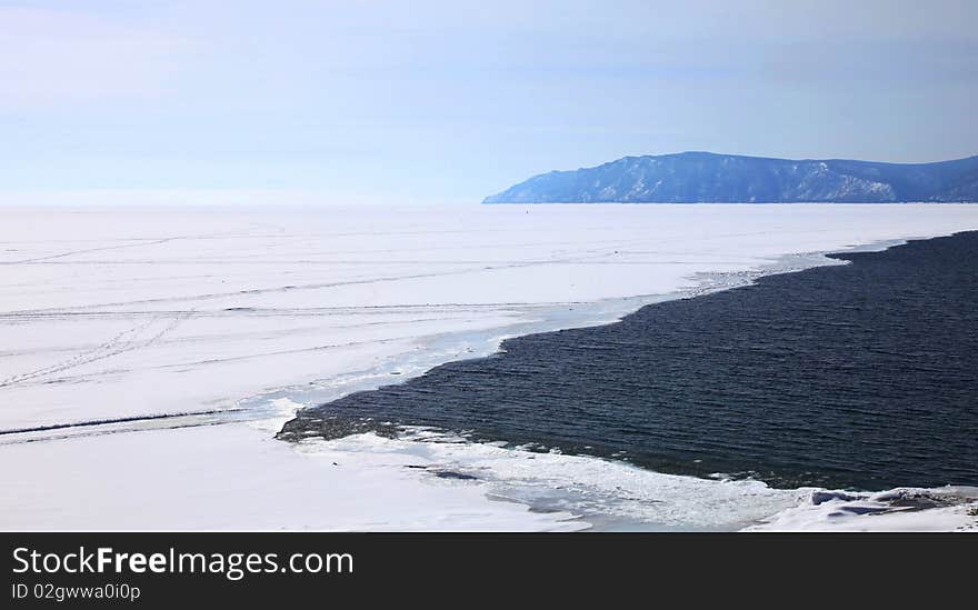 Frozen Lake Baikal. Spring. Day.