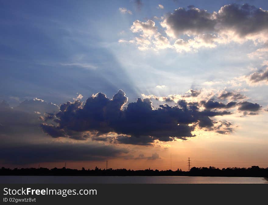 Image of sunset with tree silhouette