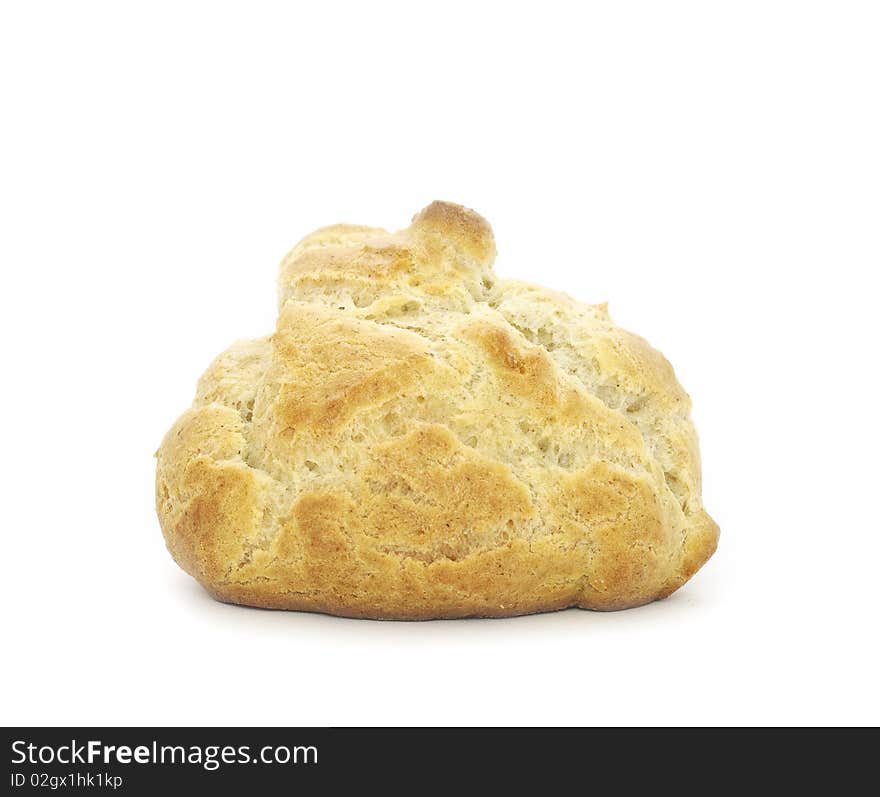 A fresh-baked homemade bun isolated on a white background