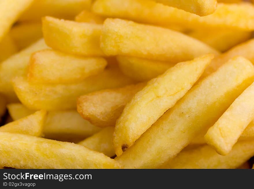 Deep fried,yellow french fries background