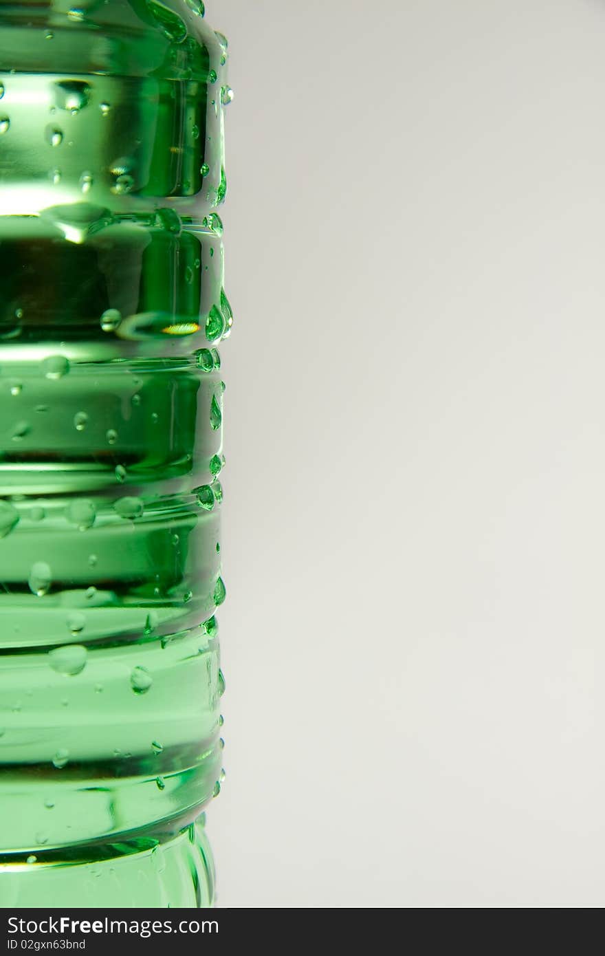 A plastic bottle filled with still water. Image isolated on white studio background. A plastic bottle filled with still water. Image isolated on white studio background.