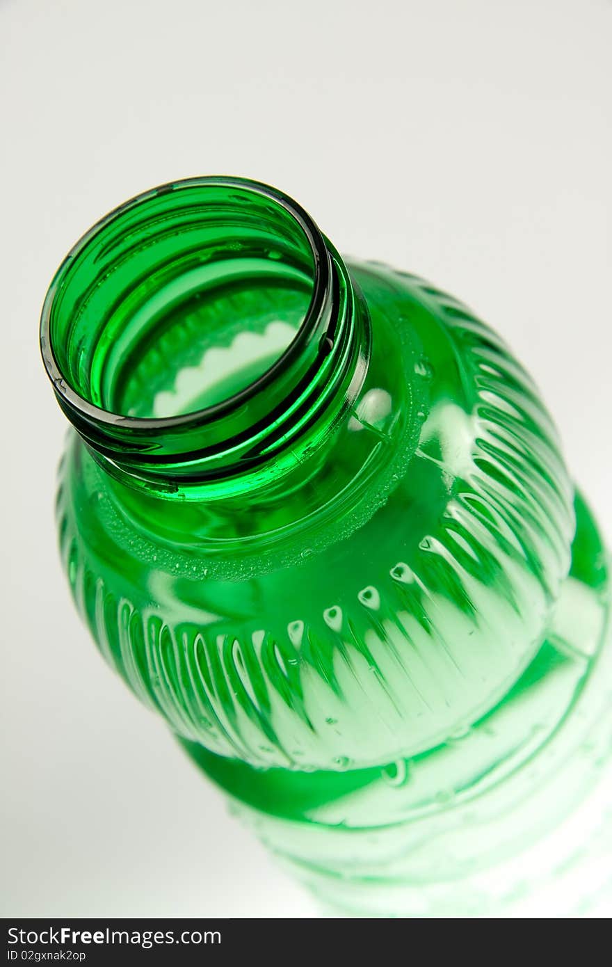 A plastic bottle filled with still water. Image isolated on white studio background. A plastic bottle filled with still water. Image isolated on white studio background.