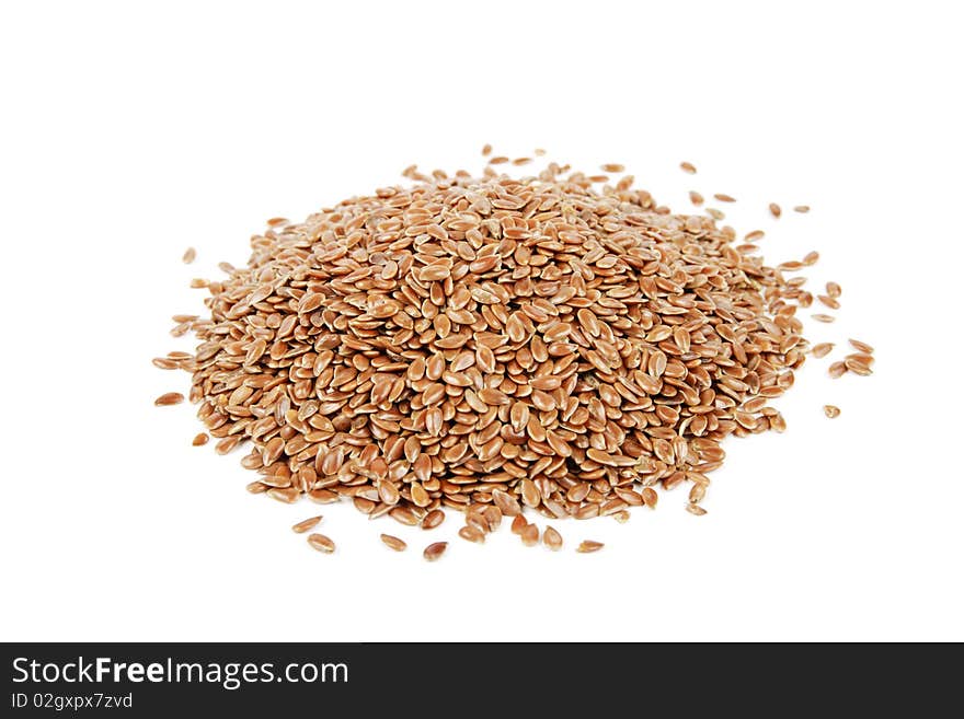 Pile of linseed on a reflective white background