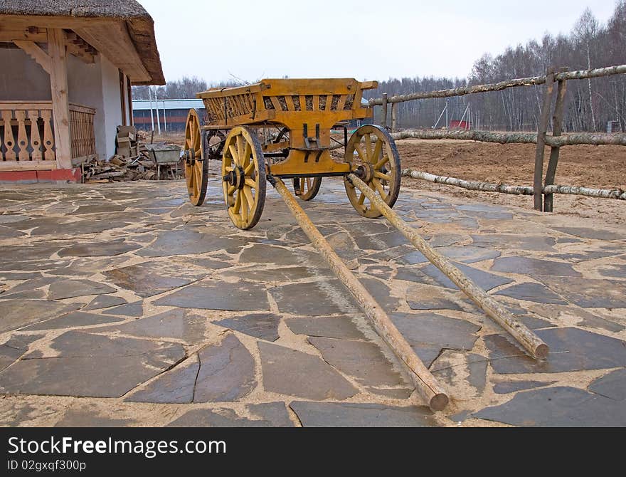 Old wooden cart near house. Old wooden cart near house