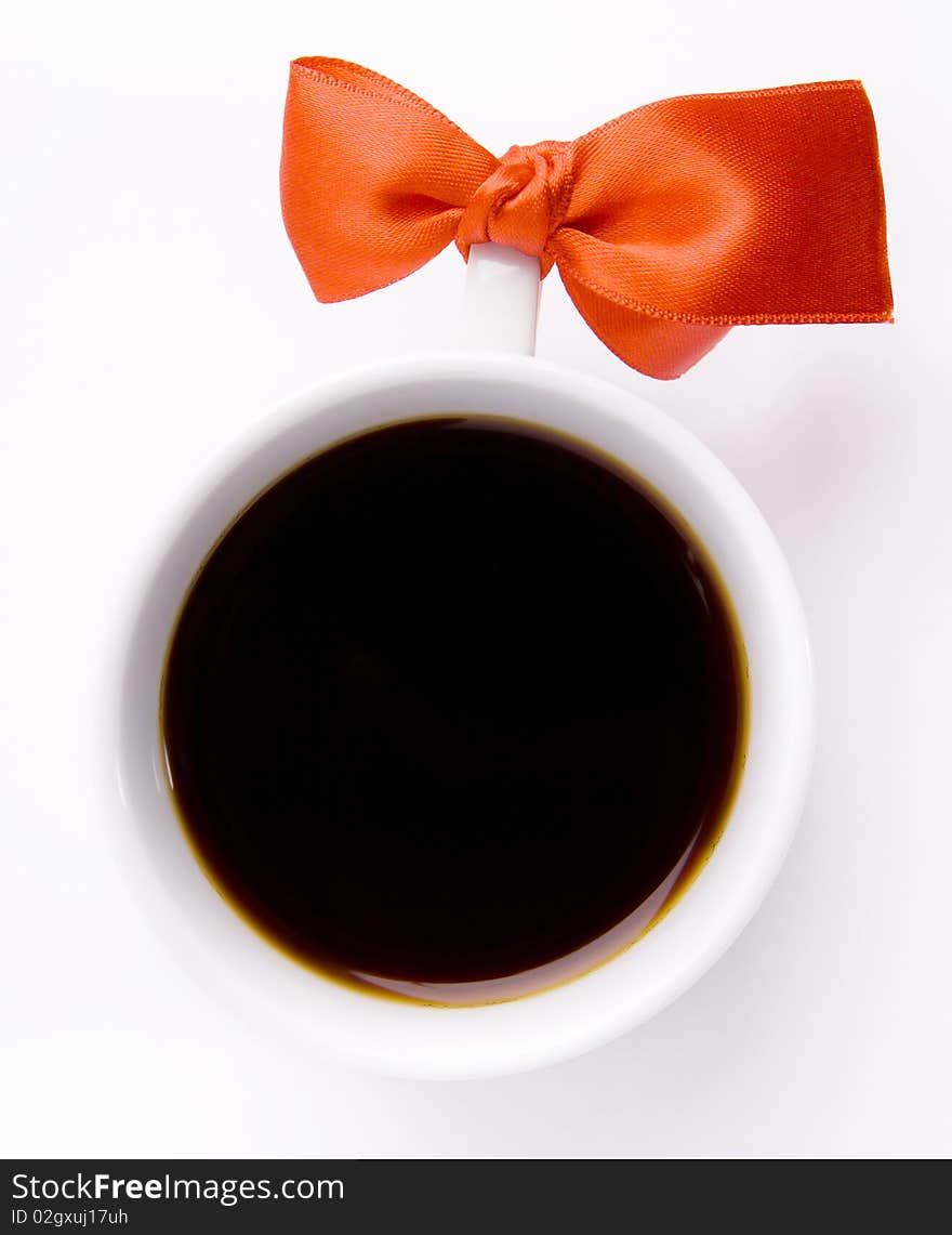 White Cup Of Coffee With A Red Bow