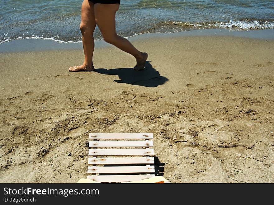 Woman walking on the beach