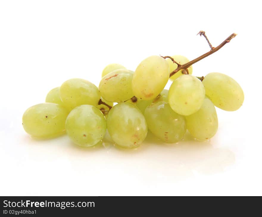 Bunch of green grapes isolated over white background