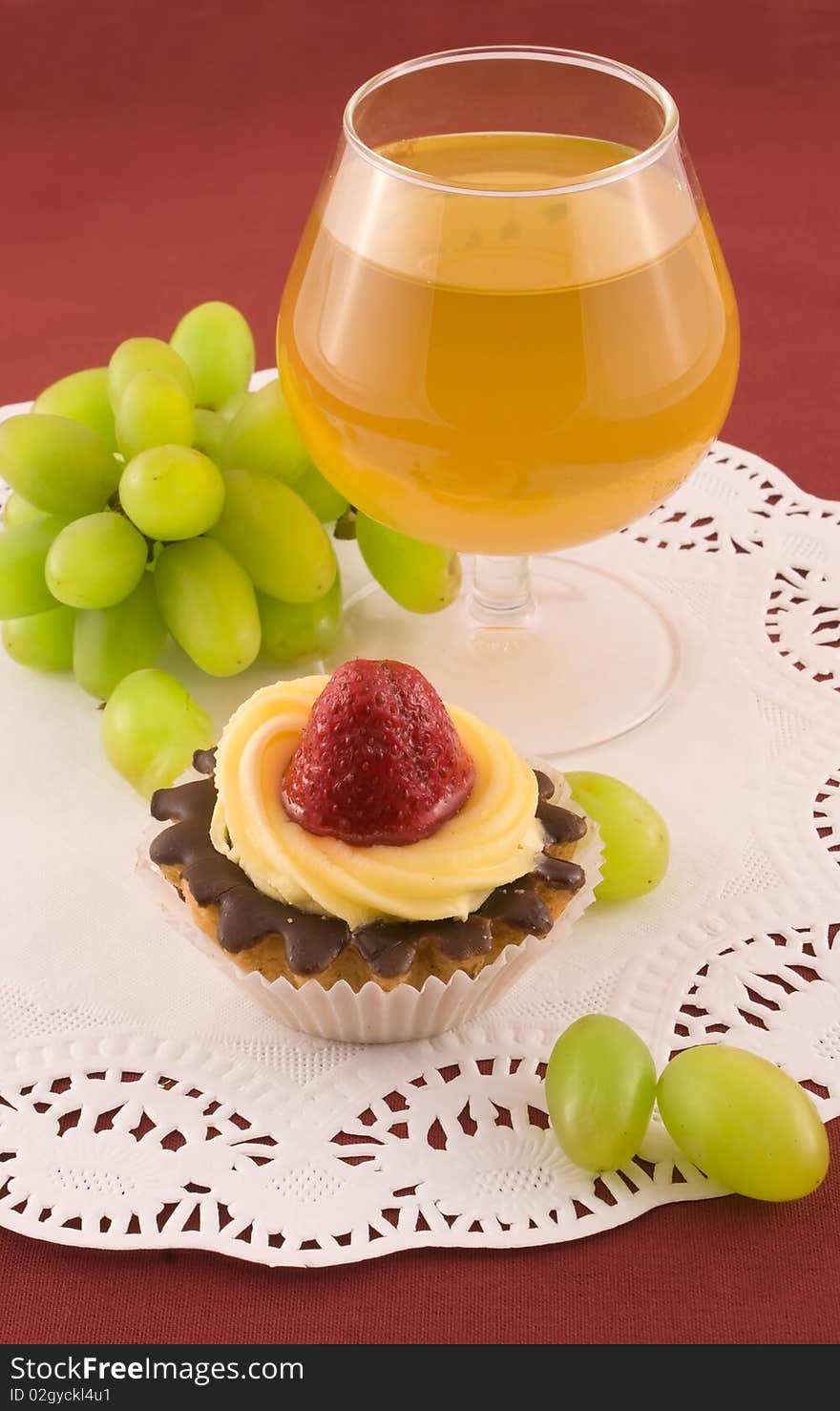 Fresh cake with strawberry, grapes and glass of white wine. Fresh cake with strawberry, grapes and glass of white wine