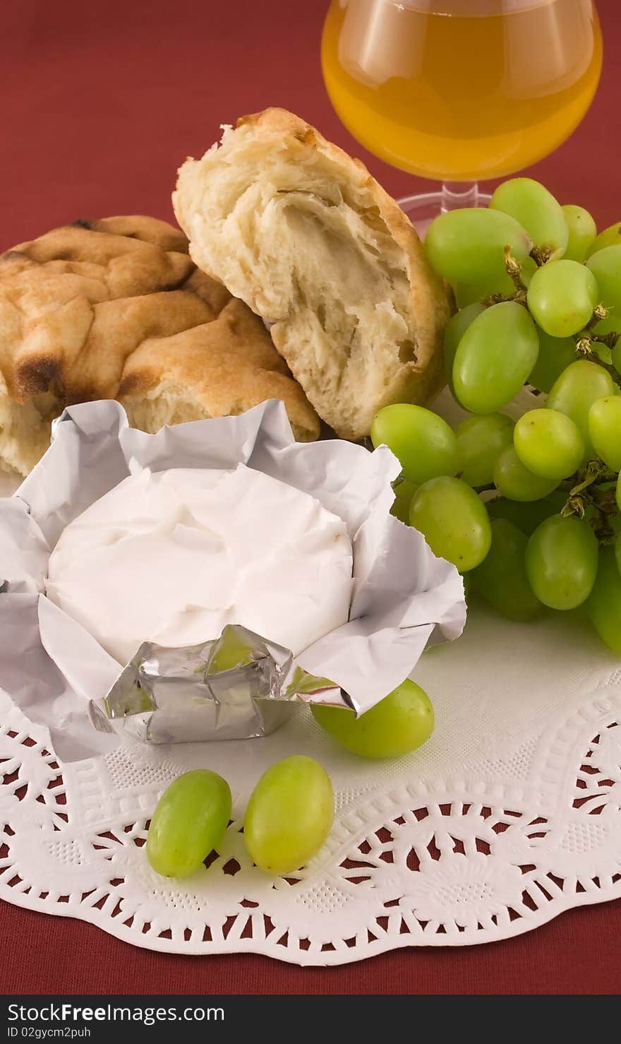 Fresh bread with grapes and cheese