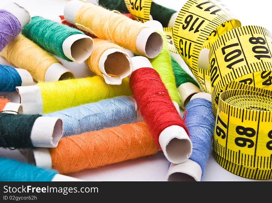 Colorful thread with yellow measuring tape