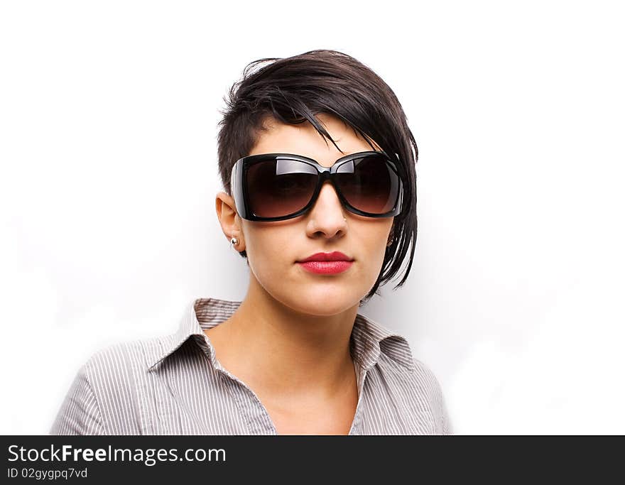 Young girl wearing sunglasses on white background. Young girl wearing sunglasses on white background