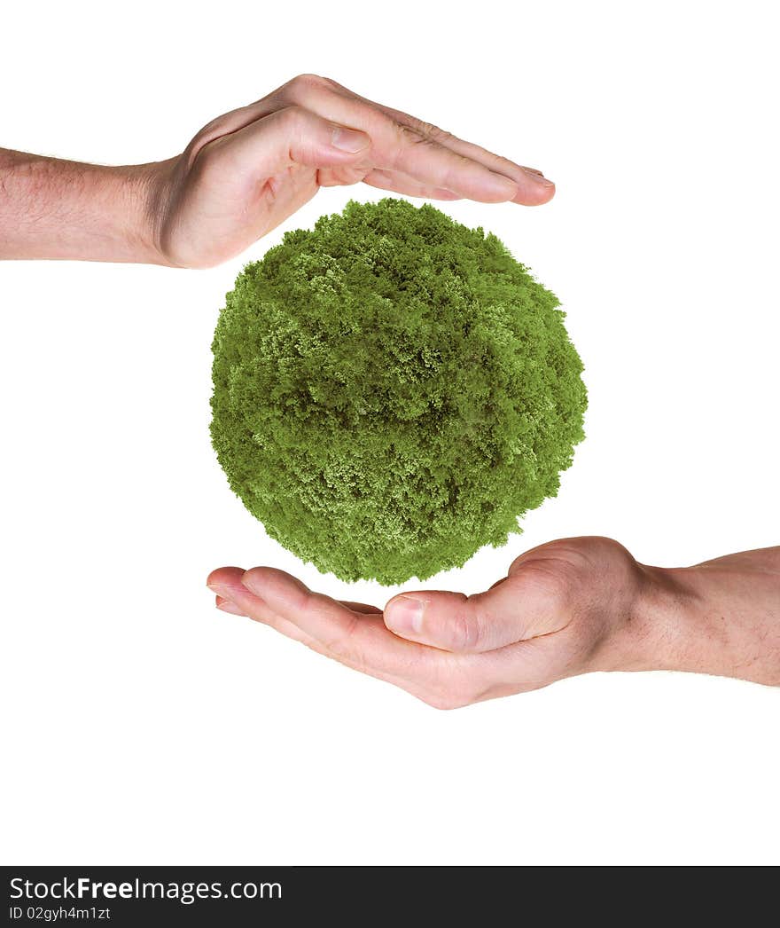 Hands protecting green planet