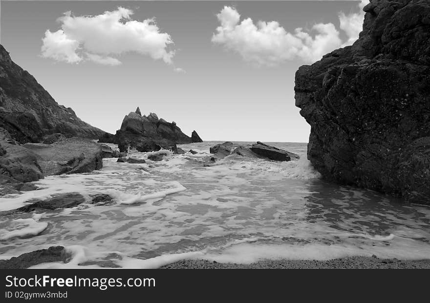 Reef in sea on sky background. Reef in sea on sky background