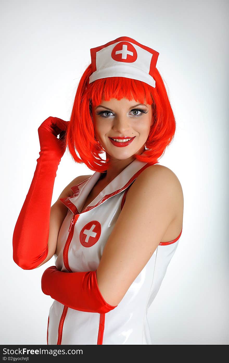 Young sexy nurse with red hair