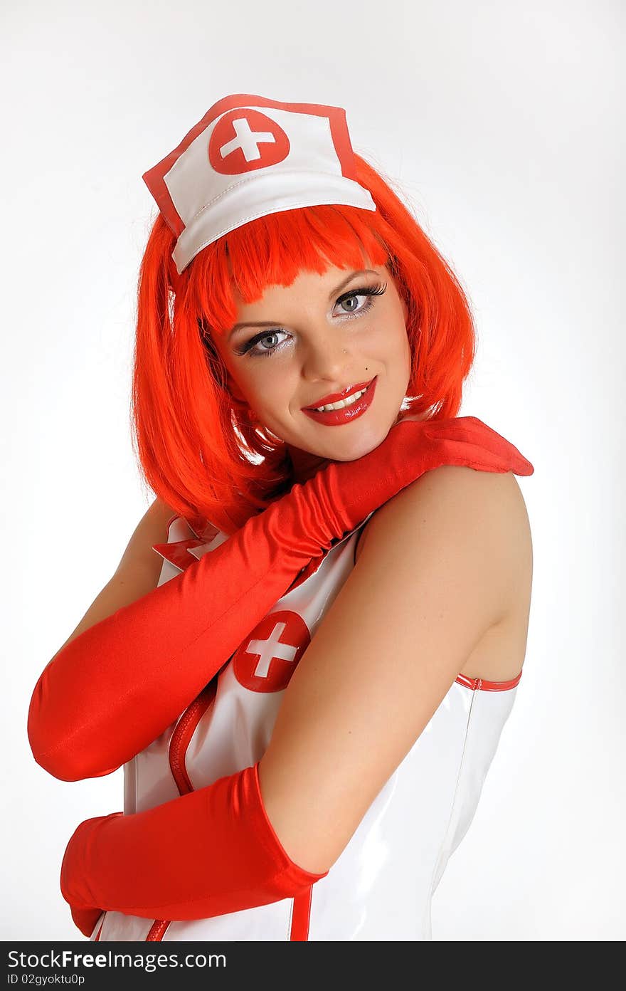 Young nurse with red hair in gloves. Young nurse with red hair in gloves