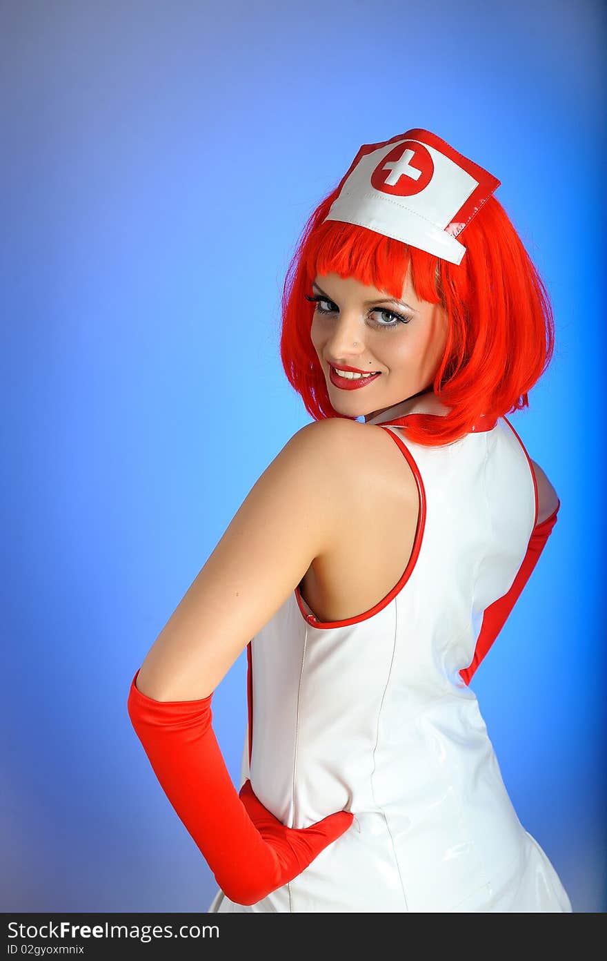 Young sexy nurse with red hair