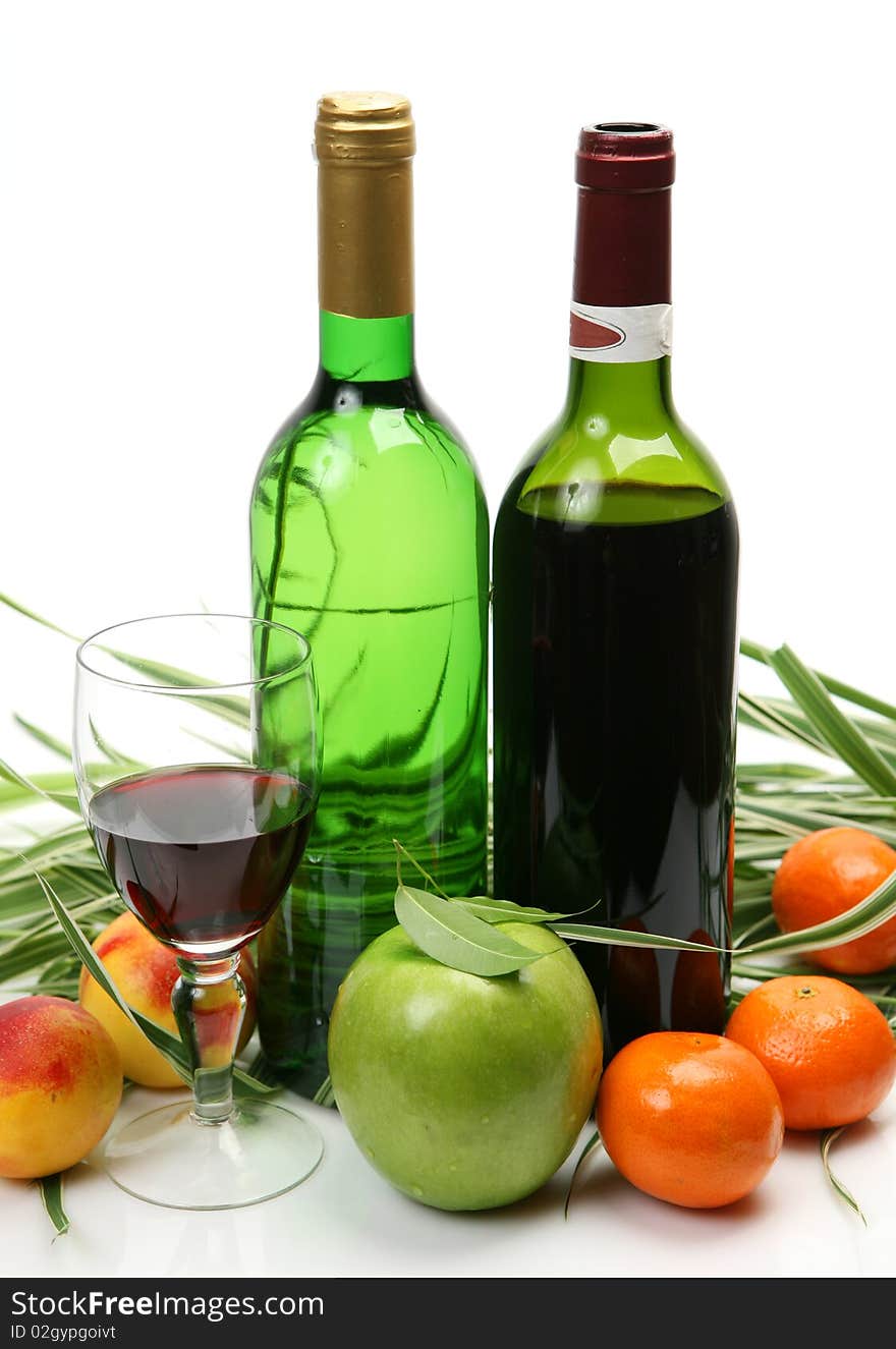 Wine and fruit on a white background