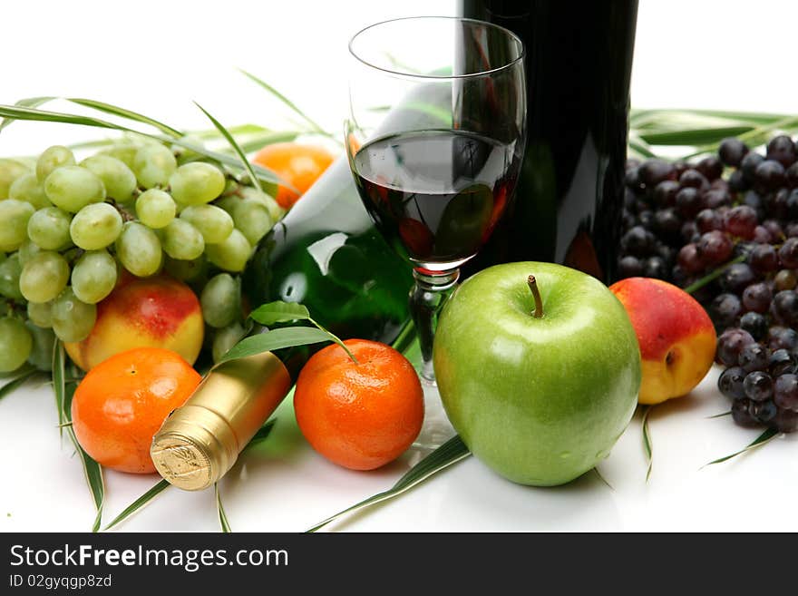 Wine and fruit on a white background