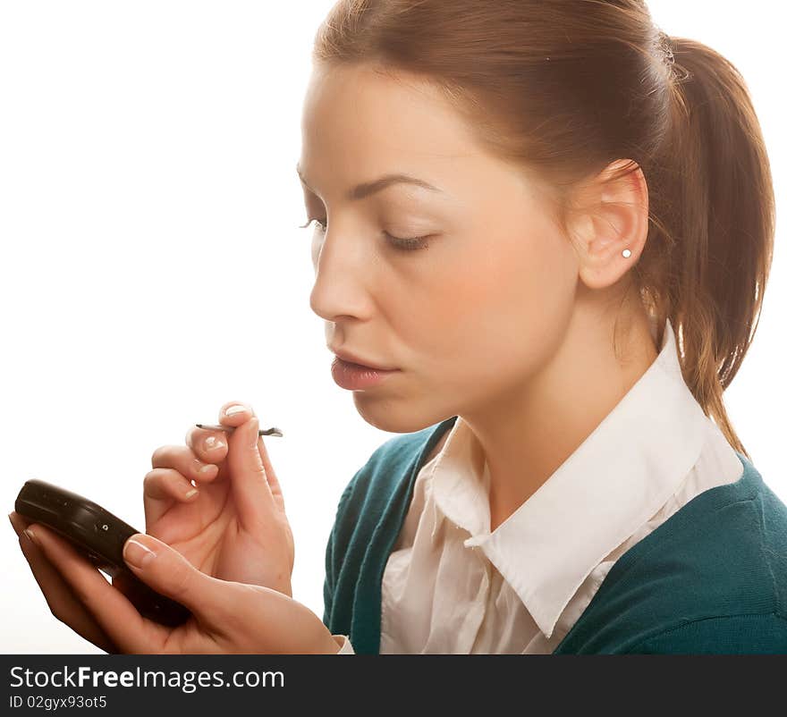 Young businesswomen with PDA.Studio shot.