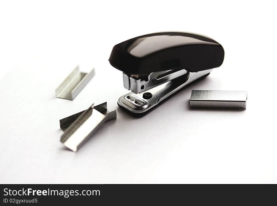 Black mini stapler and clips (small depth of sharpness). Black mini stapler and clips (small depth of sharpness)