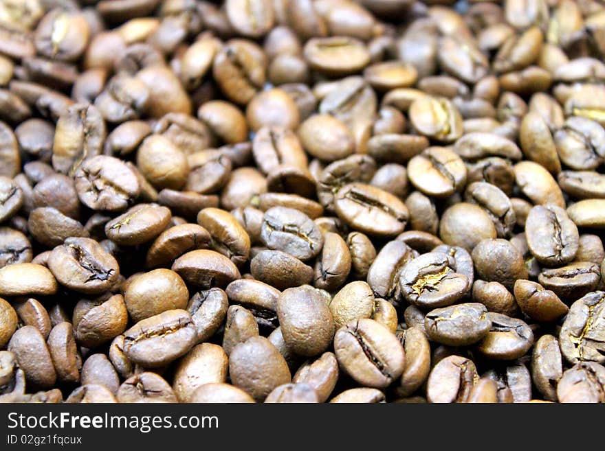 A bed of coffeebeans for background use. A bed of coffeebeans for background use.