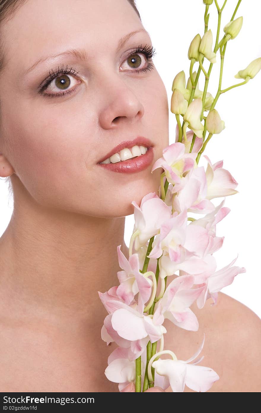 Pretty young woman portrait with orchid. Beautiful nice female face with health skin - white background. Girl on spa with flower.