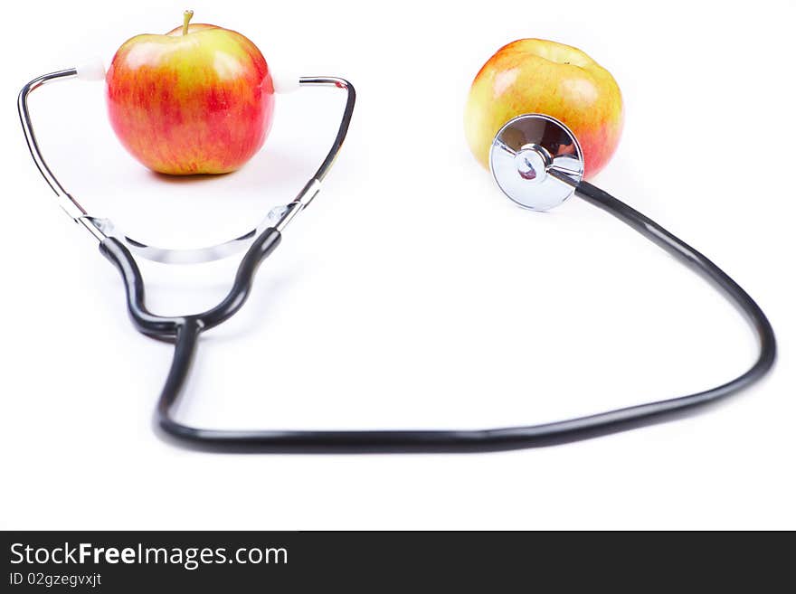 Stethoscope and apples over white background used as health and healty lifestyle symbol.