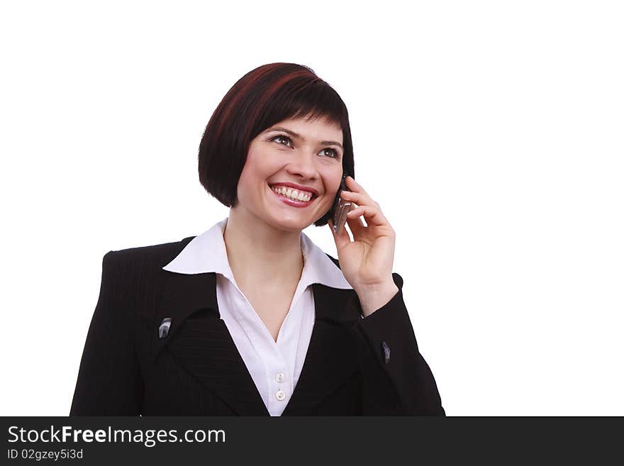 Businesswoman with mobile phone on white background. Smiling girl speaks on the mobile phone. Young female on cellular. Businesswoman with mobile phone on white background. Smiling girl speaks on the mobile phone. Young female on cellular.