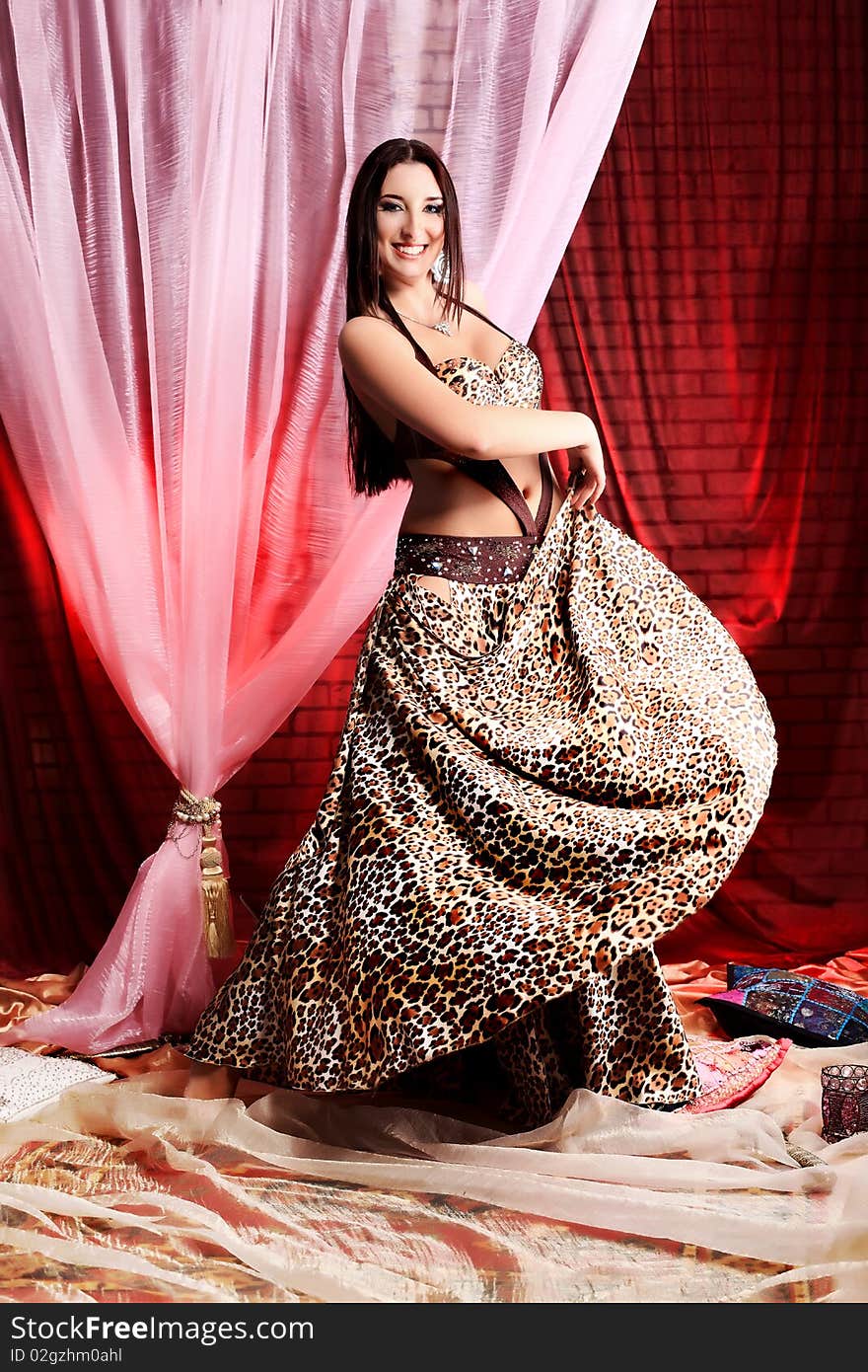 Shot of an oriental woman in a traditional costume. Shot of an oriental woman in a traditional costume.