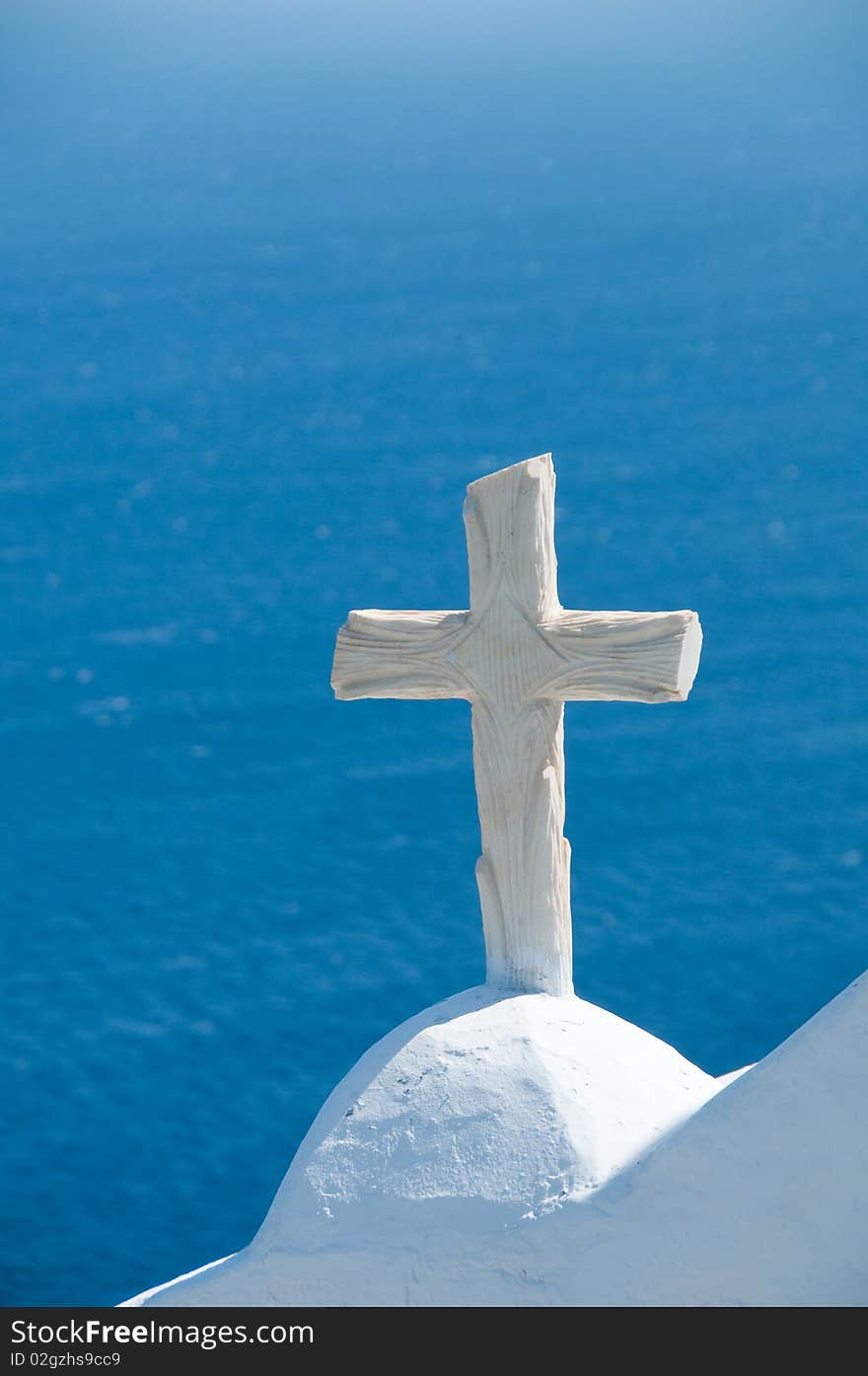 Greek church in santorini greece with a cross