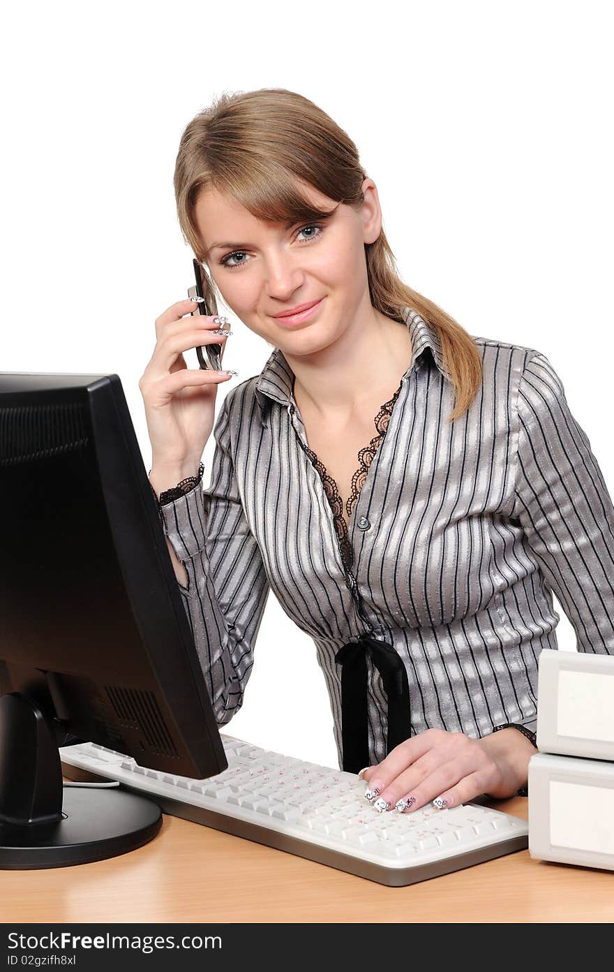 Business woman portrait smiling in front of her desktop computer. Business woman portrait smiling in front of her desktop computer