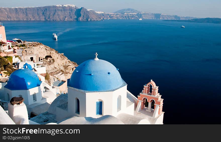 Greek church in santorini greece with a cross