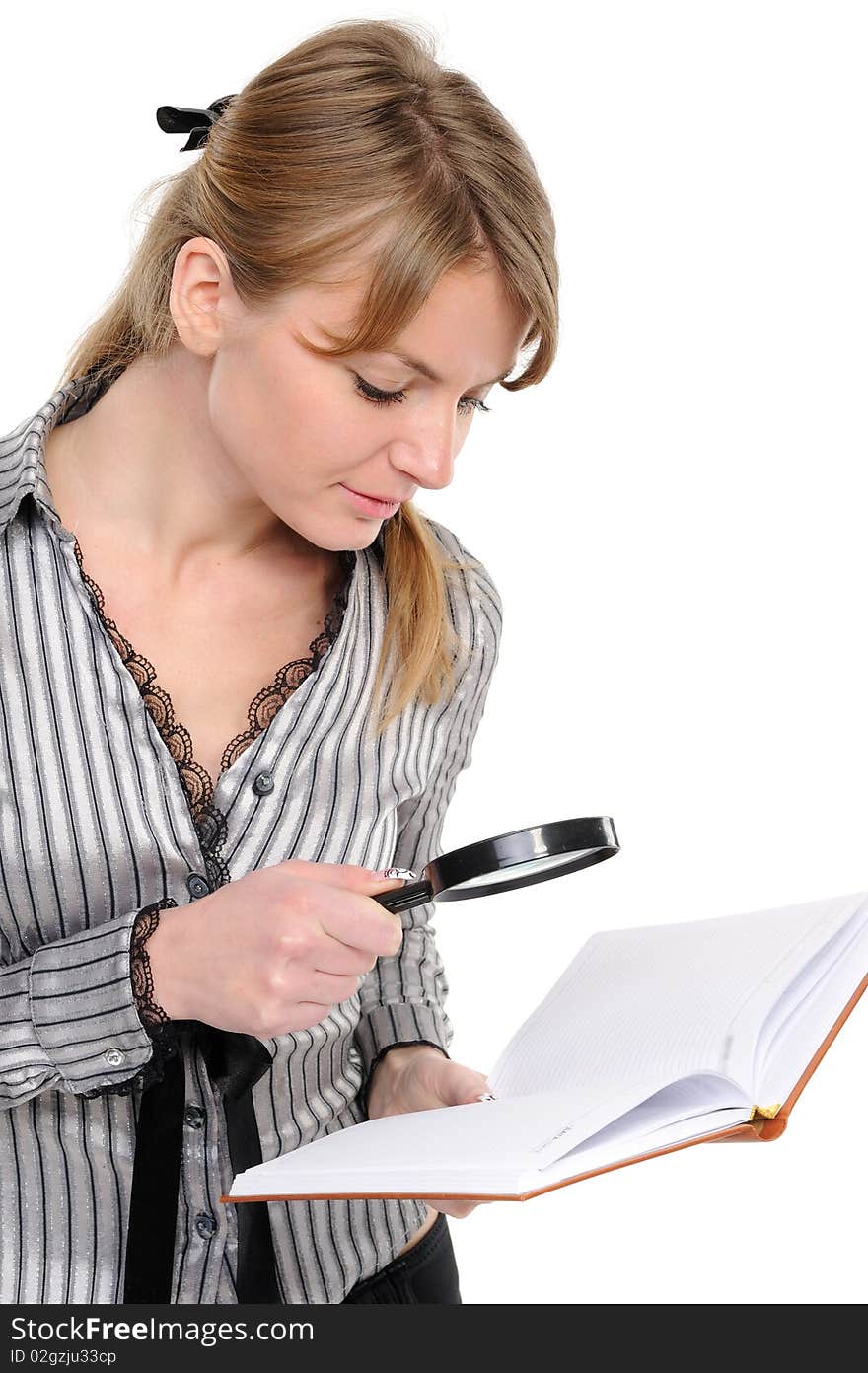 Businesswoman looking papers with magnifying glass on a white background. Businesswoman looking papers with magnifying glass on a white background