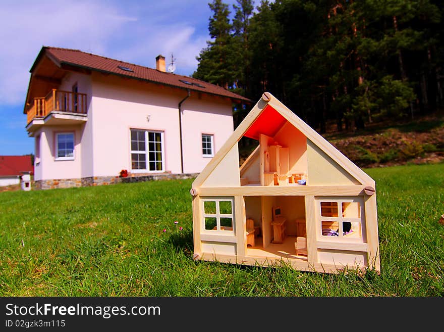 Model house and the house in real size. Model house and the house in real size