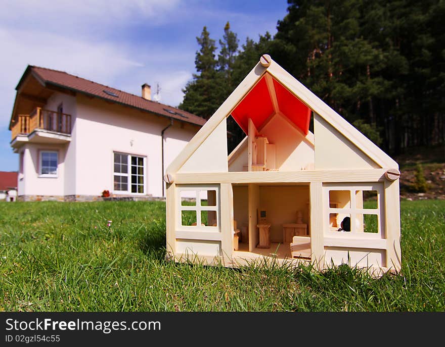 Model house and the house in real size. Model house and the house in real size