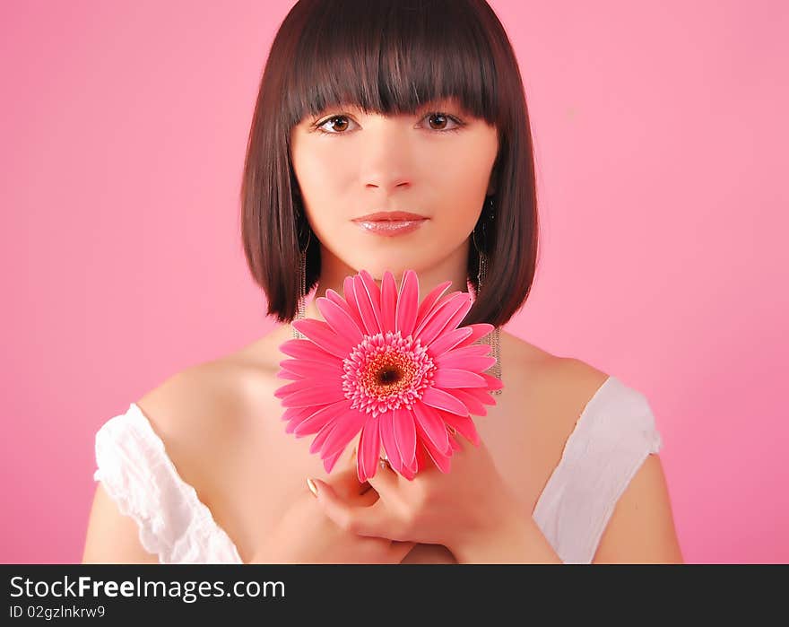 The young lady on the Grey background in studio