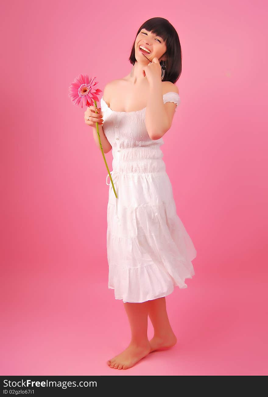 The young lady on the white background in studio