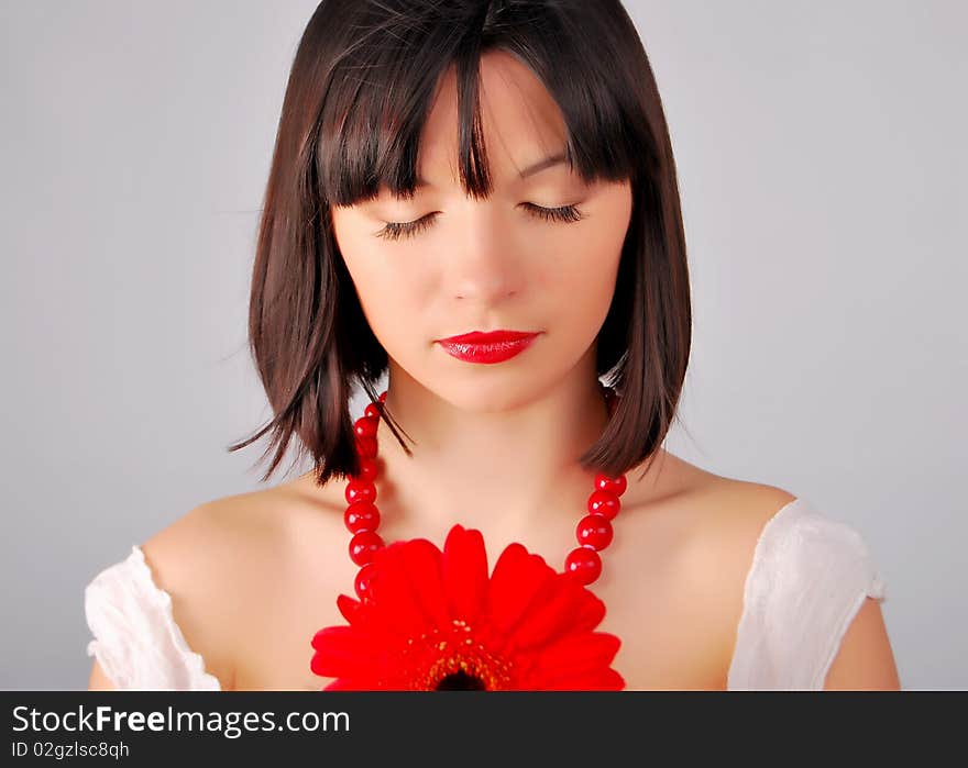 The young lady on the white background in studio