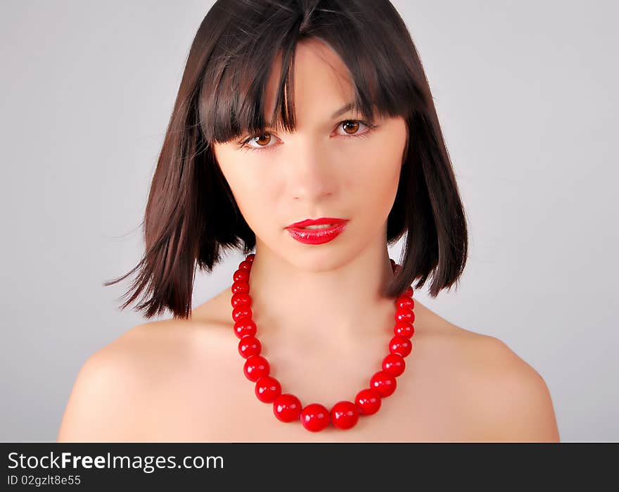 The young lady on the white background in studio