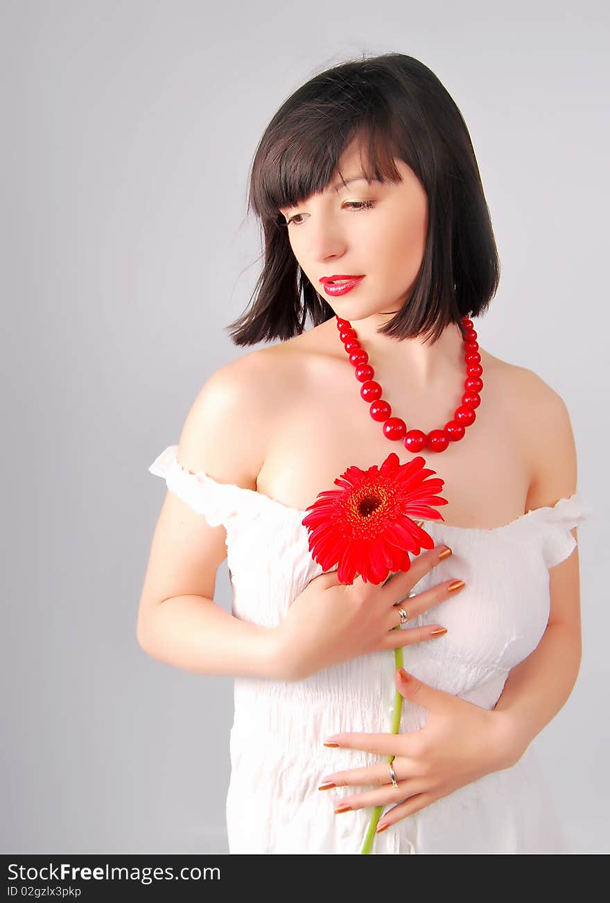 The young lady on the white background in studio