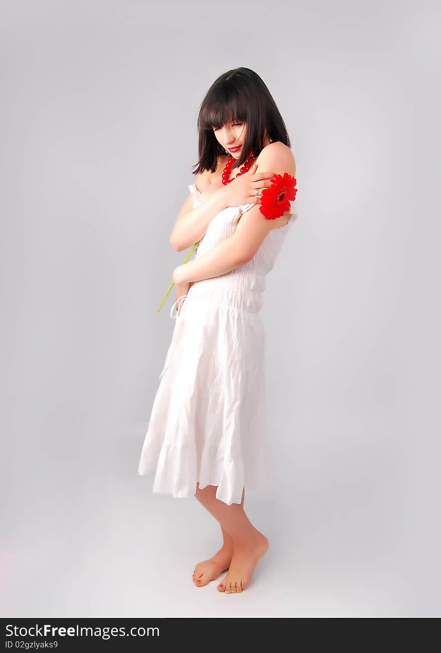 The young lady on the white background in studio