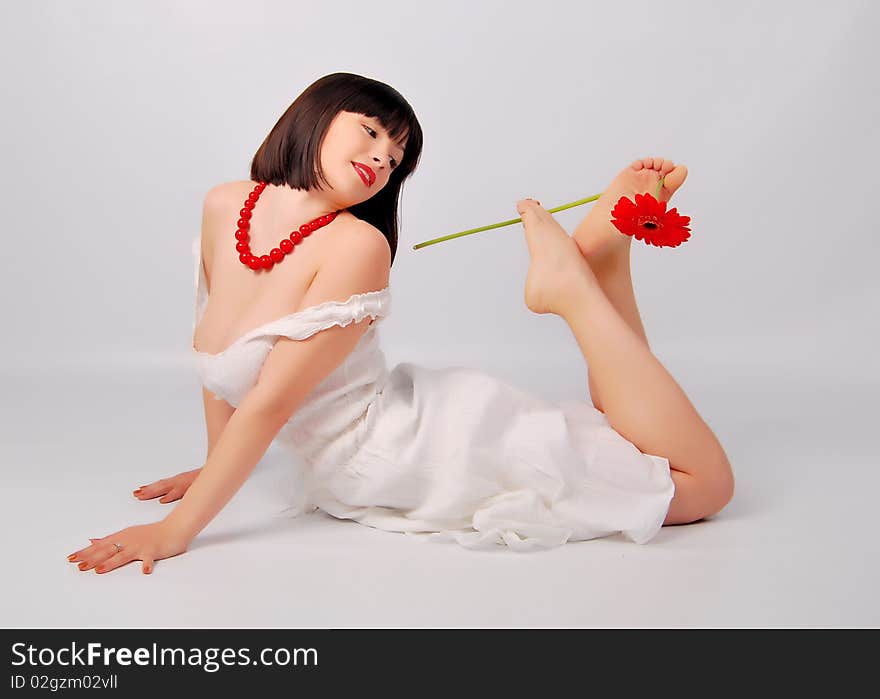 The young lady on the white background in studio