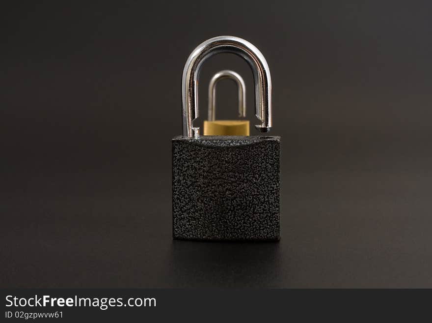 Two locks on a black background. Two locks on a black background